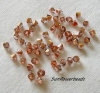 50 St�ck - Glasschliffbicone 4 mm - crystal caprigold