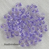 10 Gramm - Twinbeads - crystal mit Farbeinzug lavendel